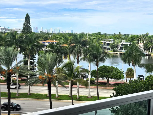 a living room with a flat screen tv and a couch