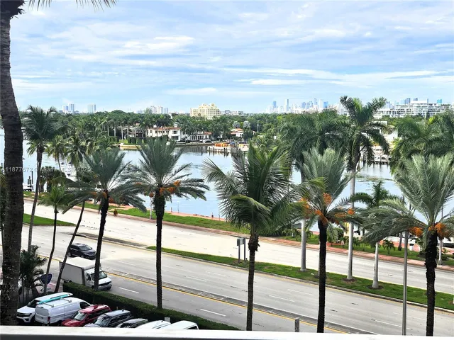 a swimming pool with outdoor seating and yard
