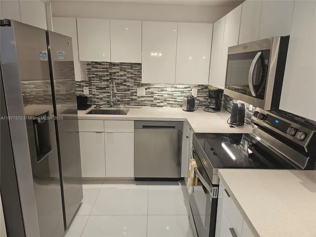 a kitchen with a stove and a microwave