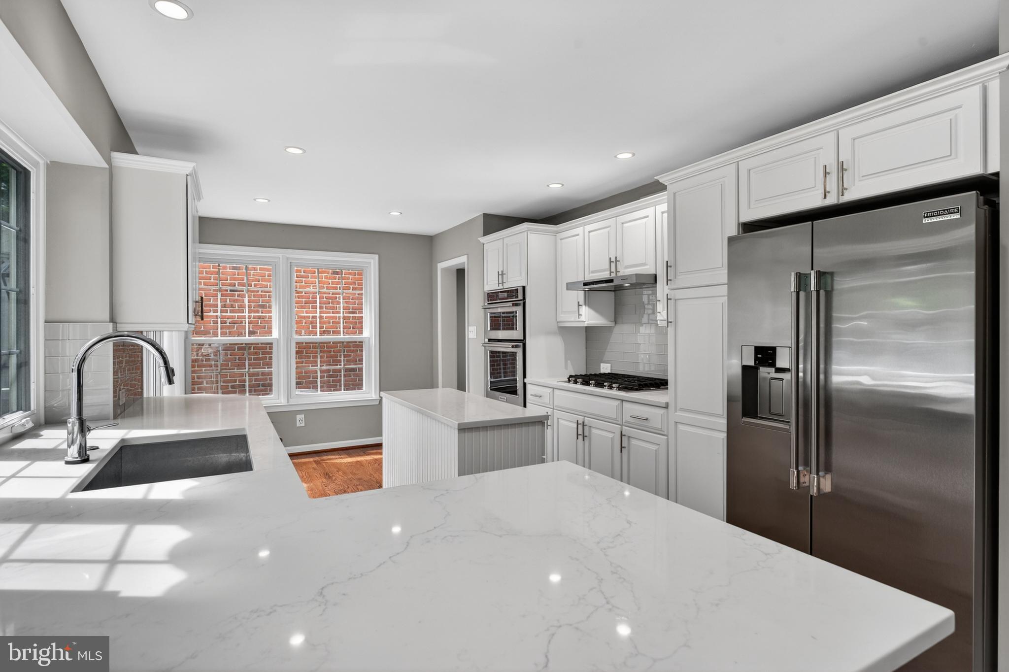 6 Nearfield Road Lutherville-Timonium, MD 21093 - Photo 24 of 71 a kitchen with stainless steel appliances a refrigerator sink and wooden cabinets