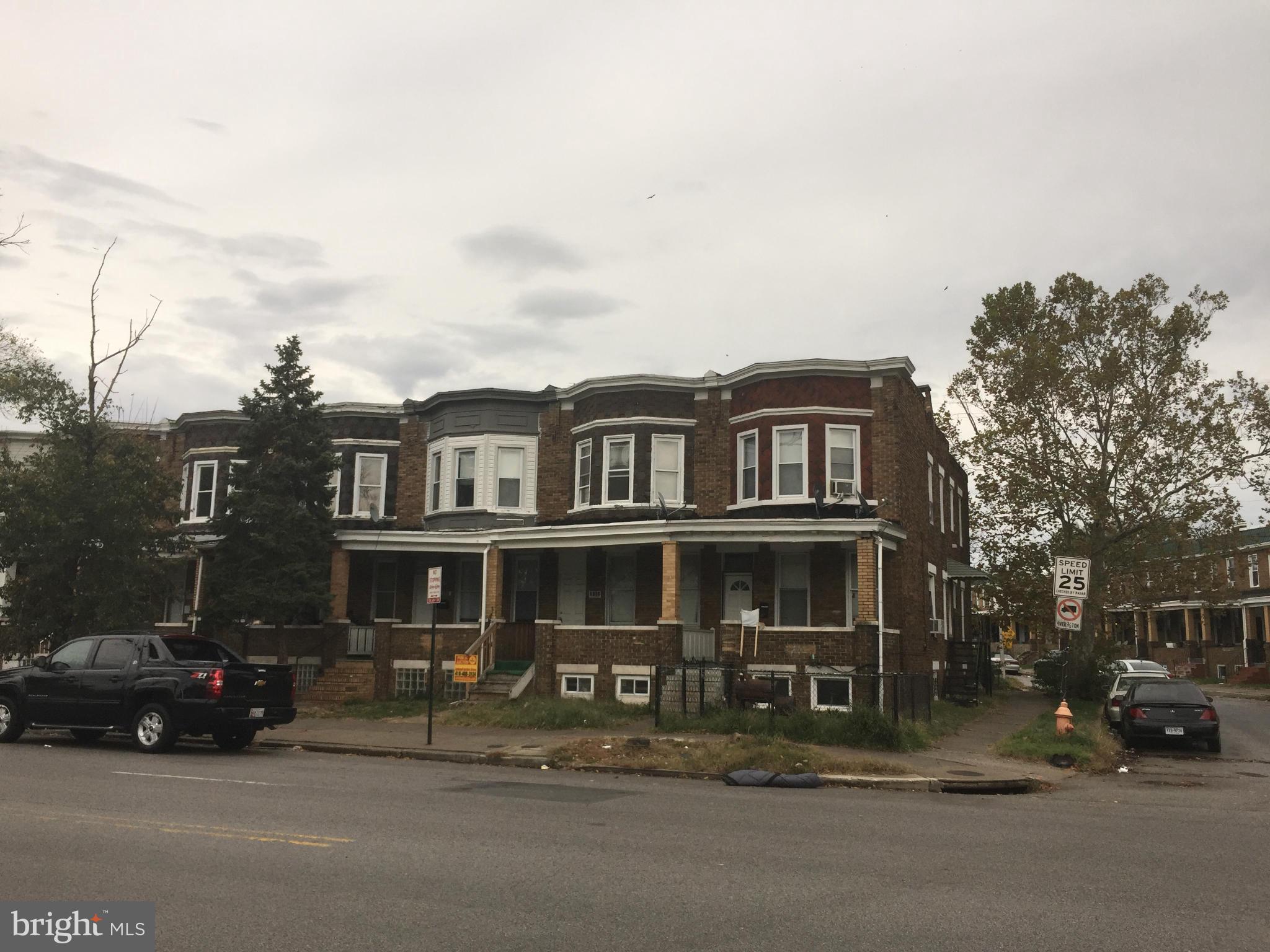 3103 Belair Road Baltimore, MD 21213 - Photo 1 of 11 a view of a car park in front of a house