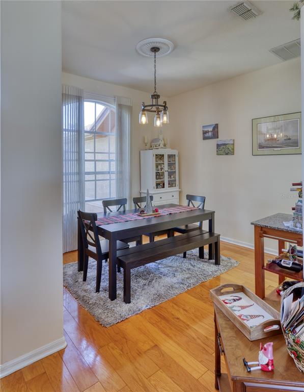 3473 Conifer Loop Spring Hill, FL 34609 - Photo 18 of 33 a living room with furniture and a table