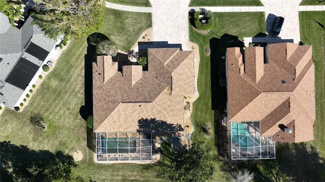 an aerial view of houses with outdoor space