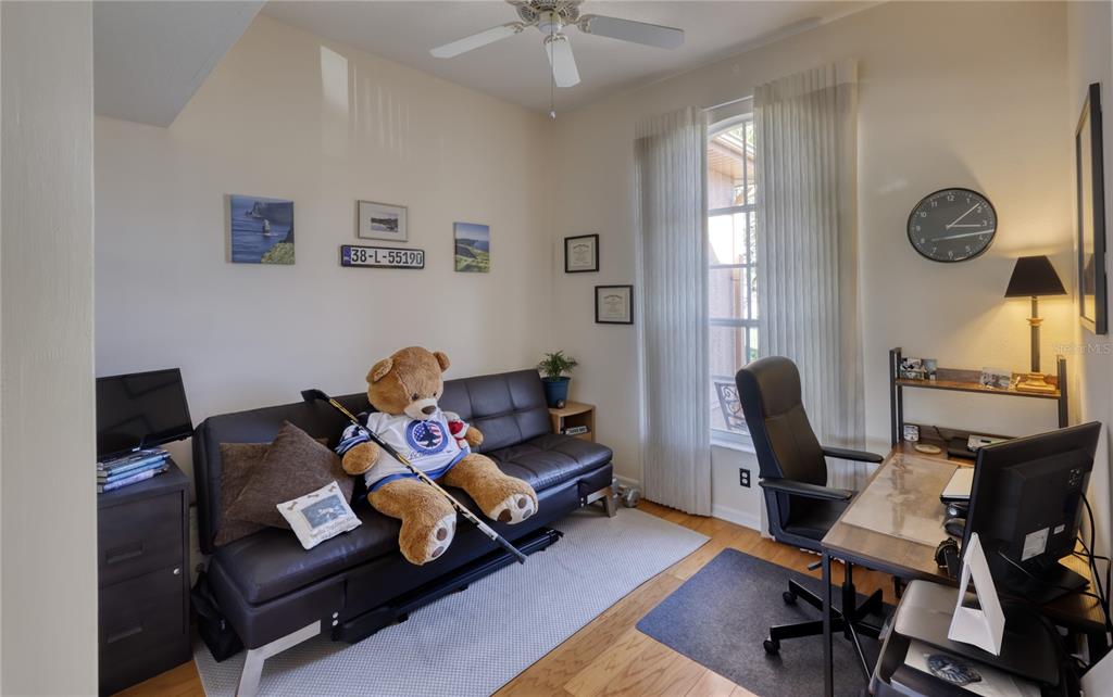 3473 Conifer Loop Spring Hill, FL 34609 - Photo 22 of 33 a living room with furniture and a window