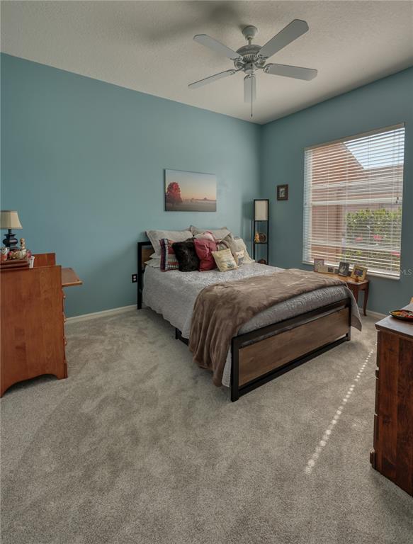 3473 Conifer Loop Spring Hill, FL 34609 - Photo 23 of 33 a bedroom with bed and window