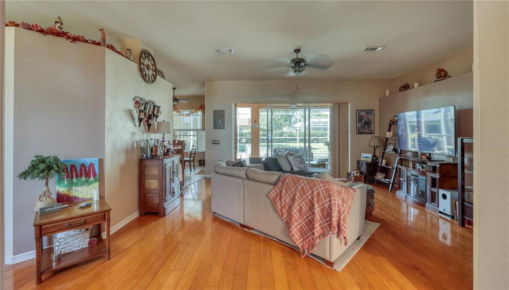 3473 Conifer Loop Spring Hill, FL 34609 - Photo 6 of 33 a living room with furniture and a large window