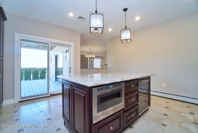 a kitchen with a stove and a wooden floors