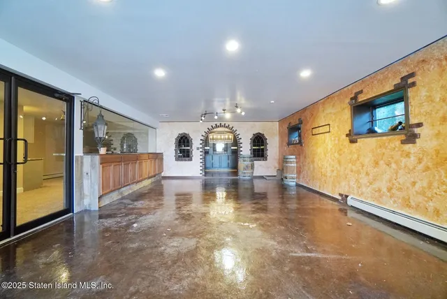 a view of a water heater room with a flat screen tv