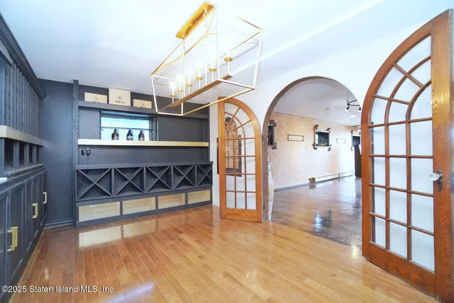 a front view of a house with a yard and table and chair