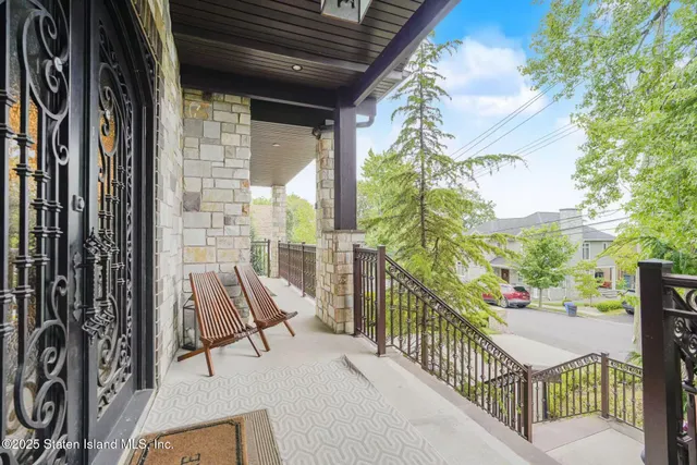 a view of balcony with furniture