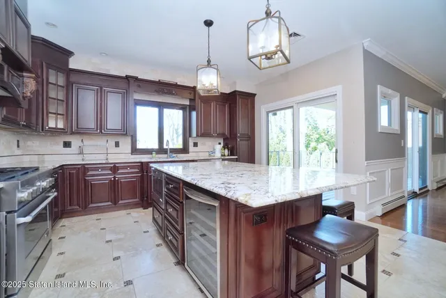 a kitchen with granite countertop counter space a sink appliances and cabinets