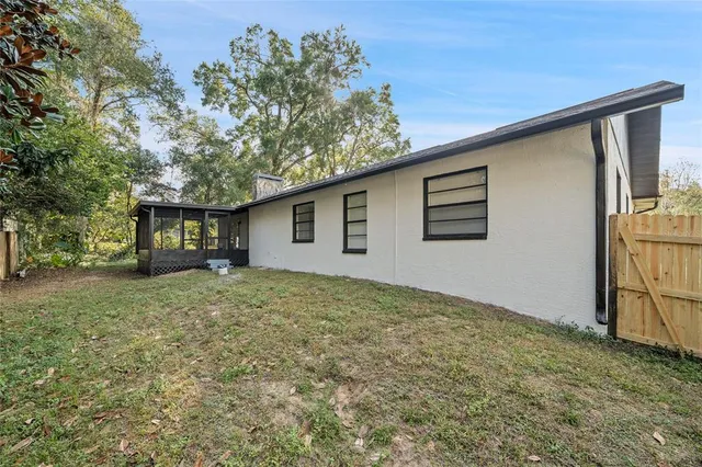 a backyard of a house with lots of green space