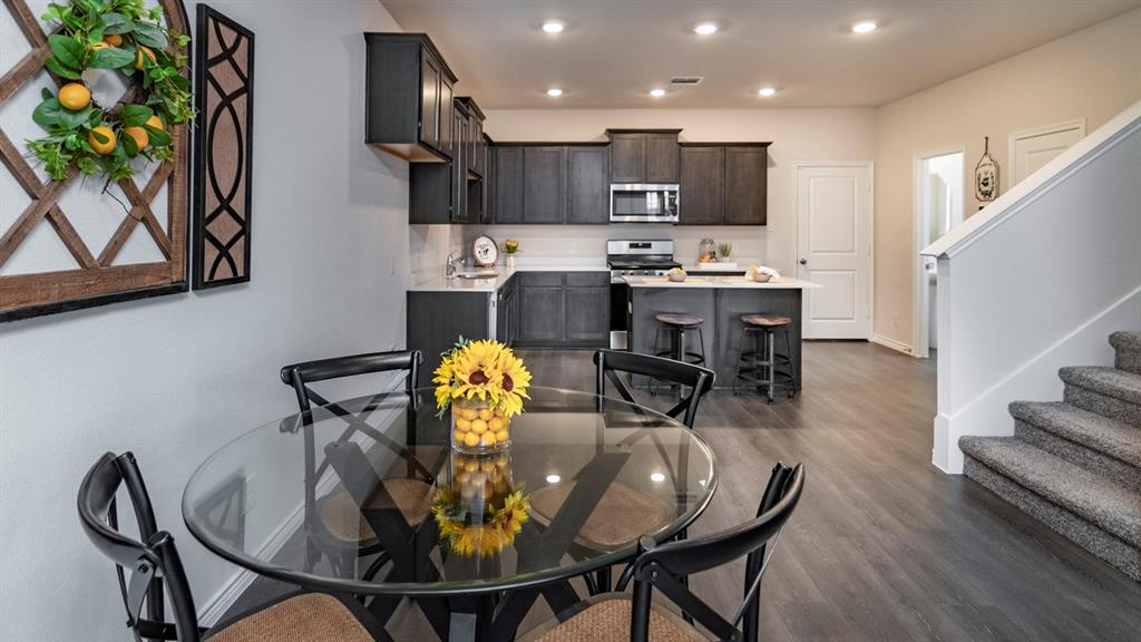2240 Lasso Court Mesquite, TX 75149 - Photo 3 of 11 a view of a dining room with furniture and wooden floor