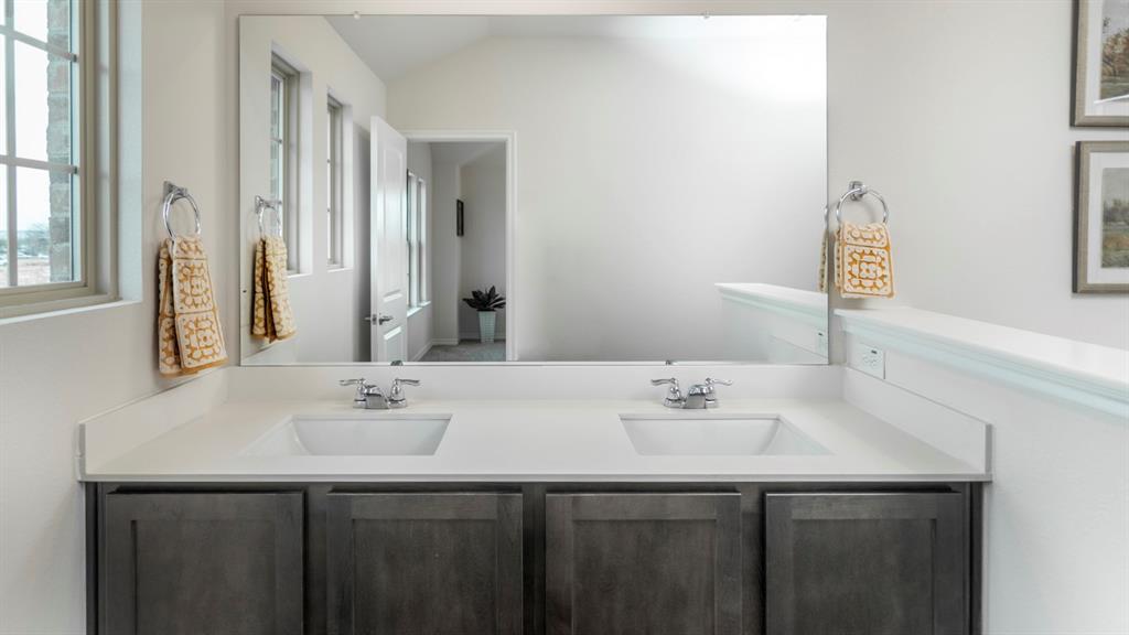 2240 Lasso Court Mesquite, TX 75149 - Photo 6 of 11 a bathroom with a sink and a mirror