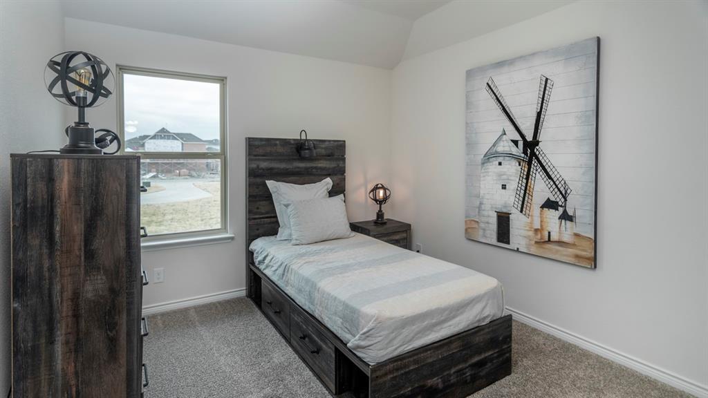 2240 Lasso Court Mesquite, TX 75149 - Photo 8 of 11 a bedroom with a bed and window