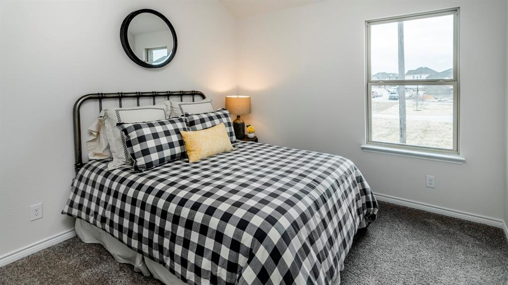 2240 Lasso Court Mesquite, TX 75149 - Photo 9 of 11 a bedroom with a bed and a window