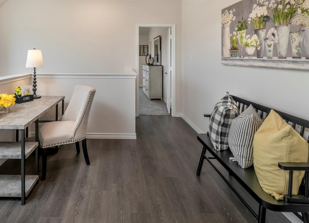 2240 Lasso Court Mesquite, TX 75149 - Photo 10 of 11 a view of a dining room with furniture and wooden floor
