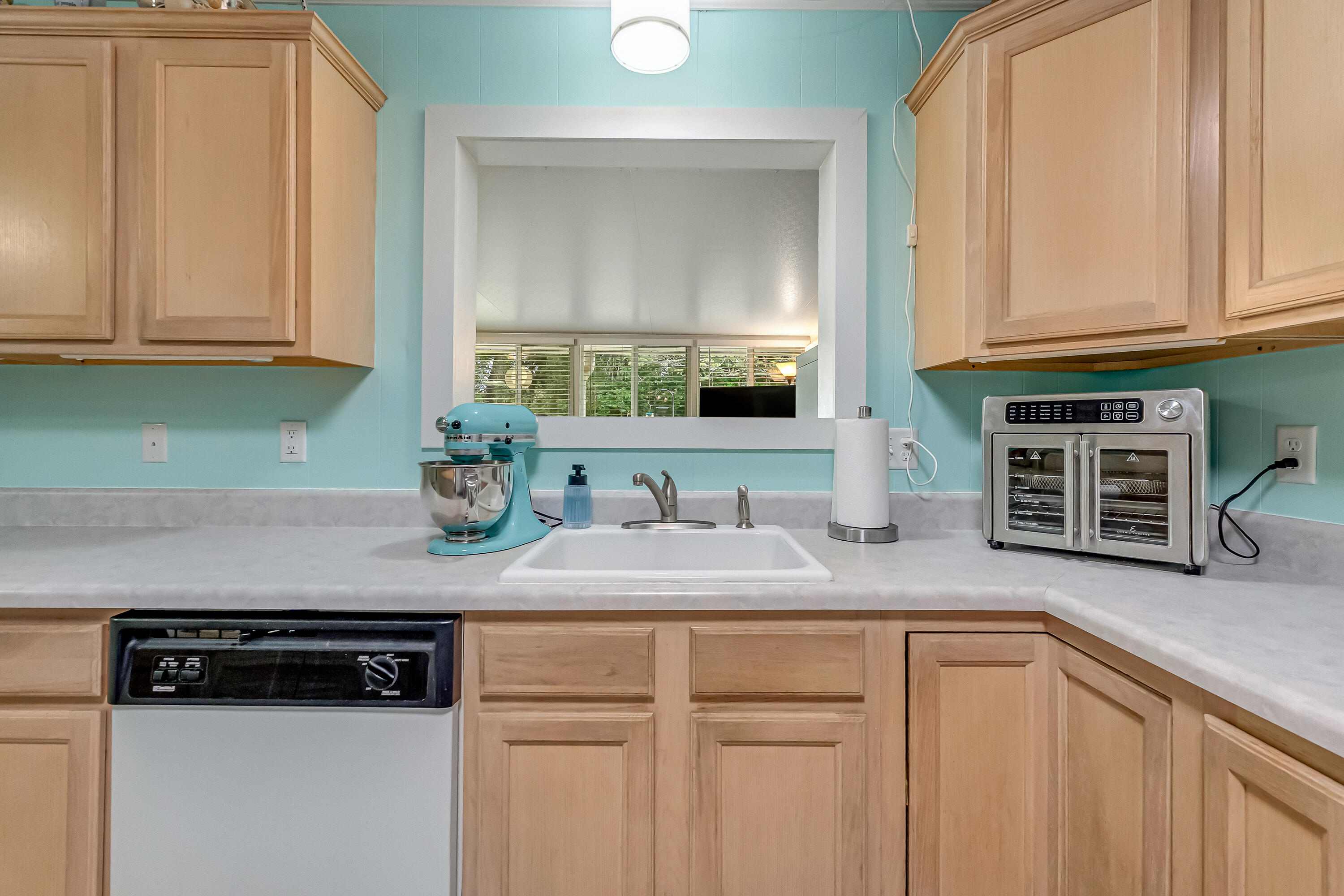 1811 Rattan Palm Drive Niceville, FL 32578 - Photo 12 of 57 a kitchen with stainless steel appliances granite countertop a sink a stove and cabinets