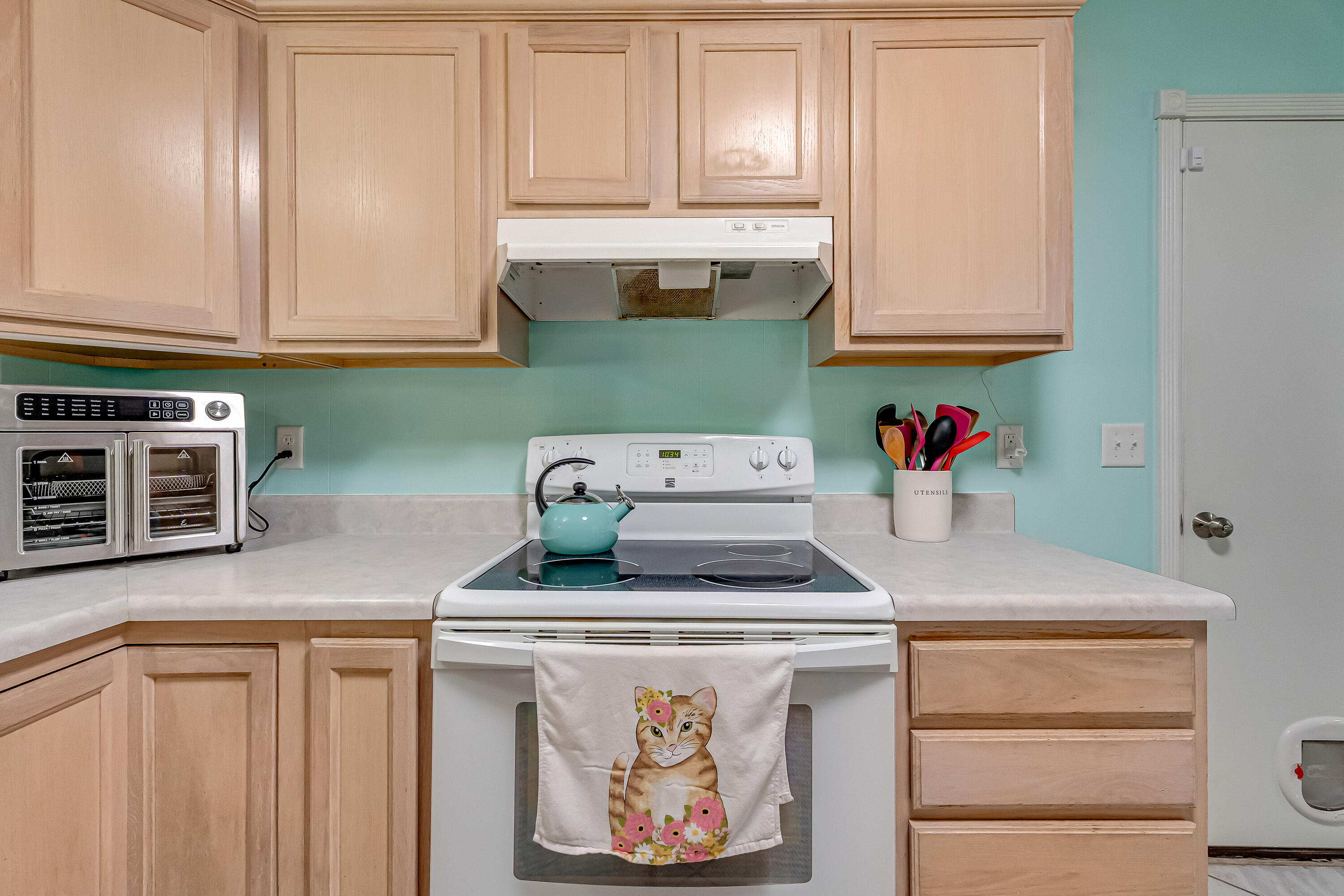 1811 Rattan Palm Drive Niceville, FL 32578 - Photo 14 of 57 a kitchen with stainless steel appliances granite countertop a sink stove and cabinets