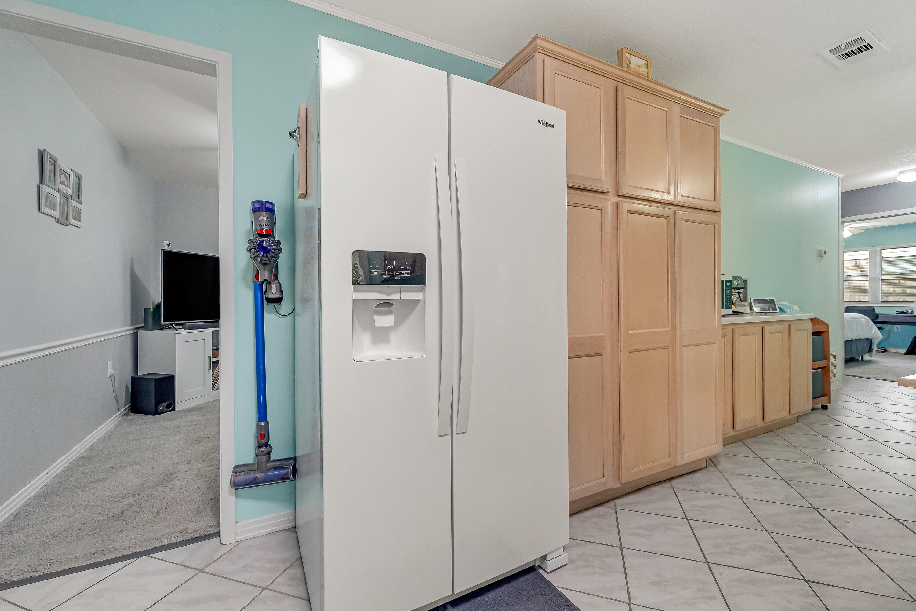 1811 Rattan Palm Drive Niceville, FL 32578 - Photo 15 of 57 a white refrigerator freezer and a stove sitting inside of a kitchen