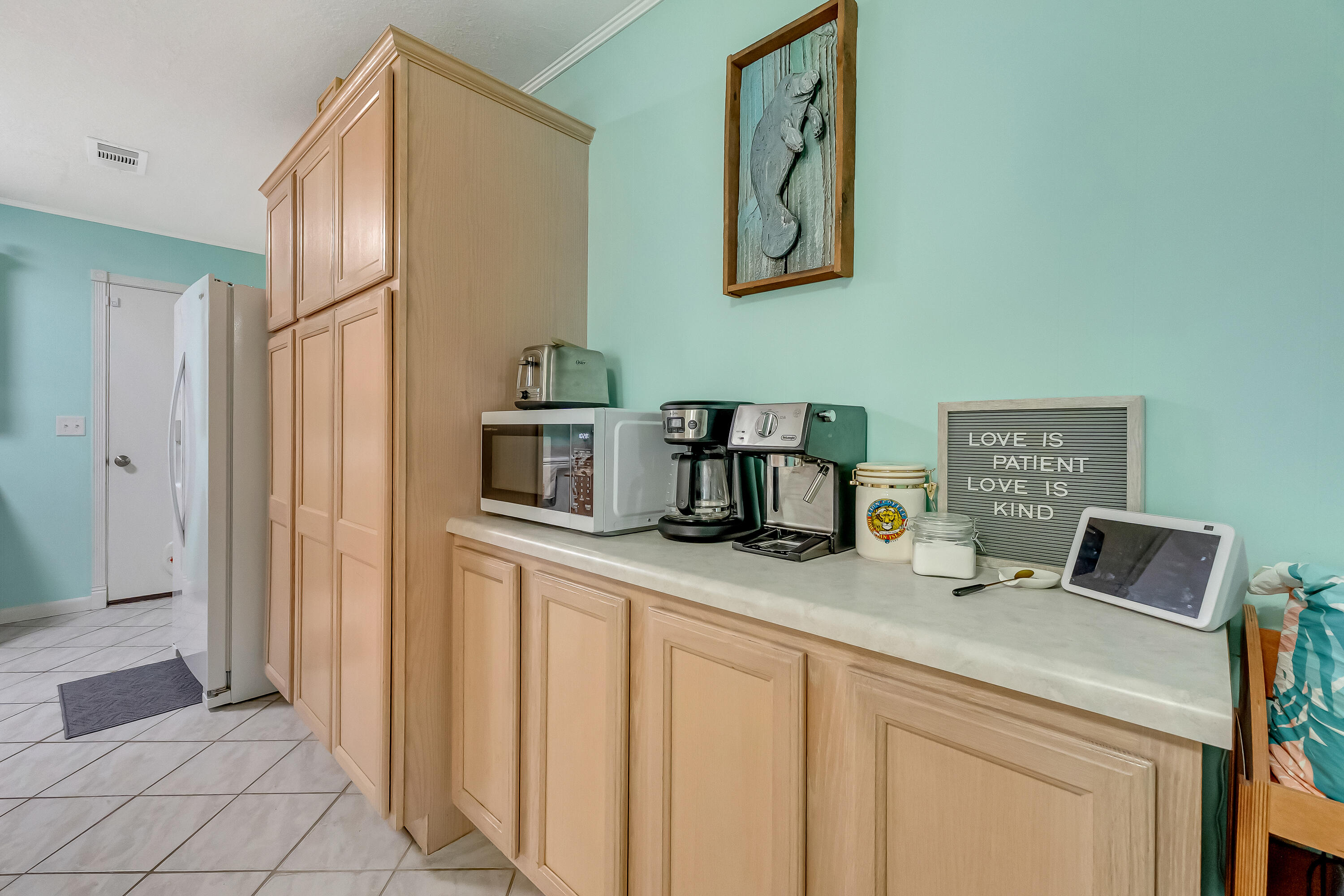 1811 Rattan Palm Drive Niceville, FL 32578 - Photo 16 of 57 a kitchen with sink cabinets and refrigerator