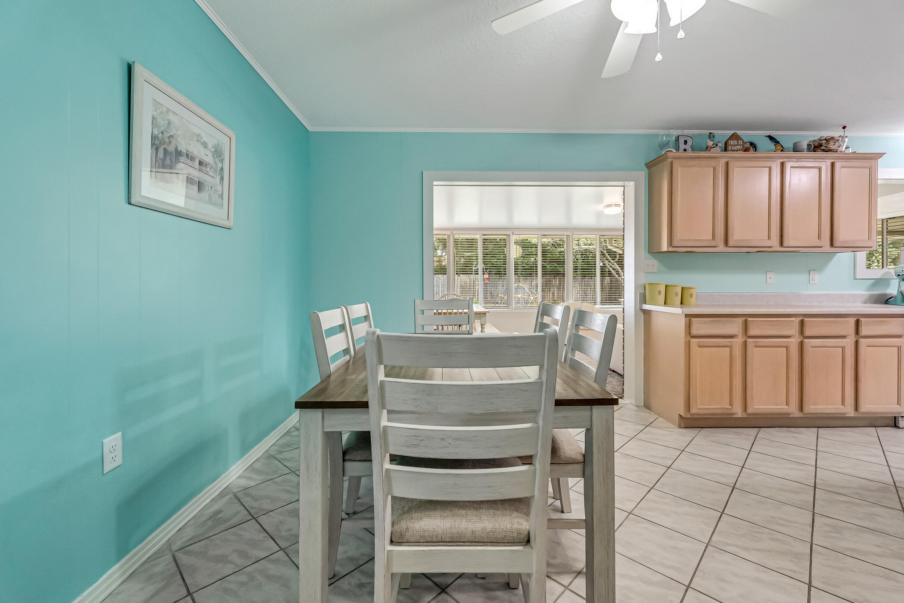 1811 Rattan Palm Drive Niceville, FL 32578 - Photo 20 of 57 a kitchen with a cabinets and chairs
