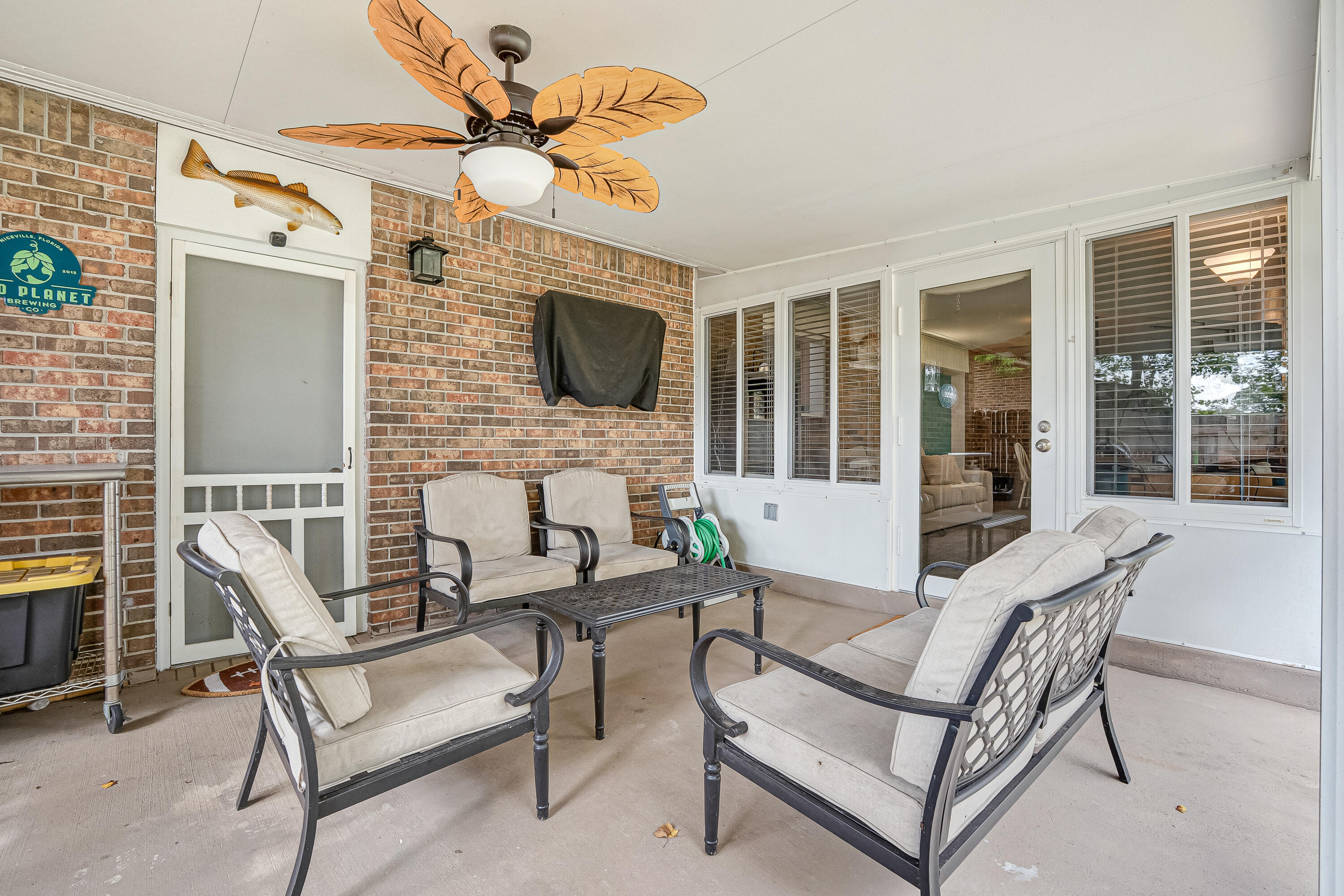 1811 Rattan Palm Drive Niceville, FL 32578 - Photo 42 of 57 a view of a livingroom with furniture and a flat screen tv