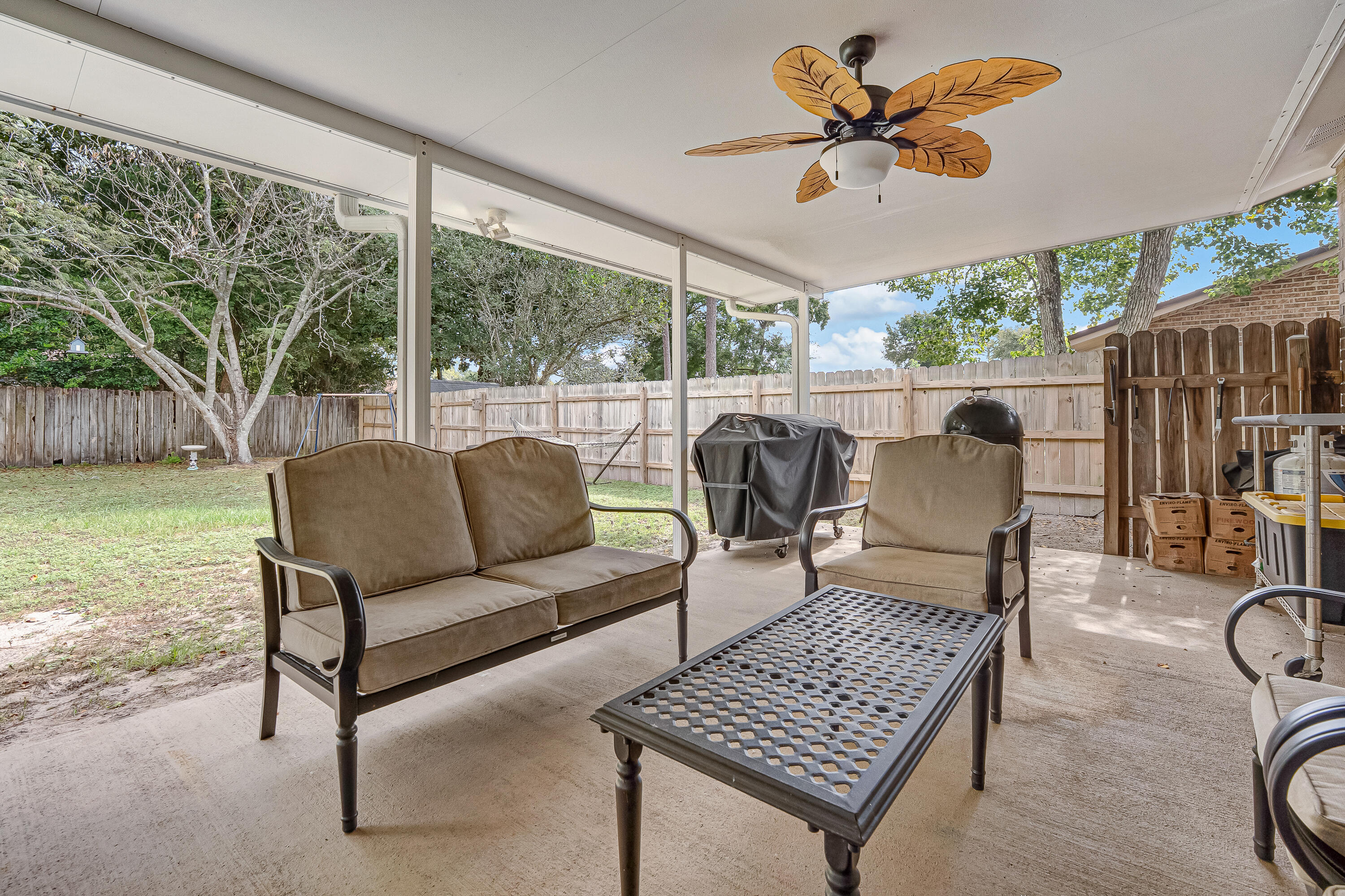 1811 Rattan Palm Drive Niceville, FL 32578 - Photo 44 of 57 a living room with furniture and a large window