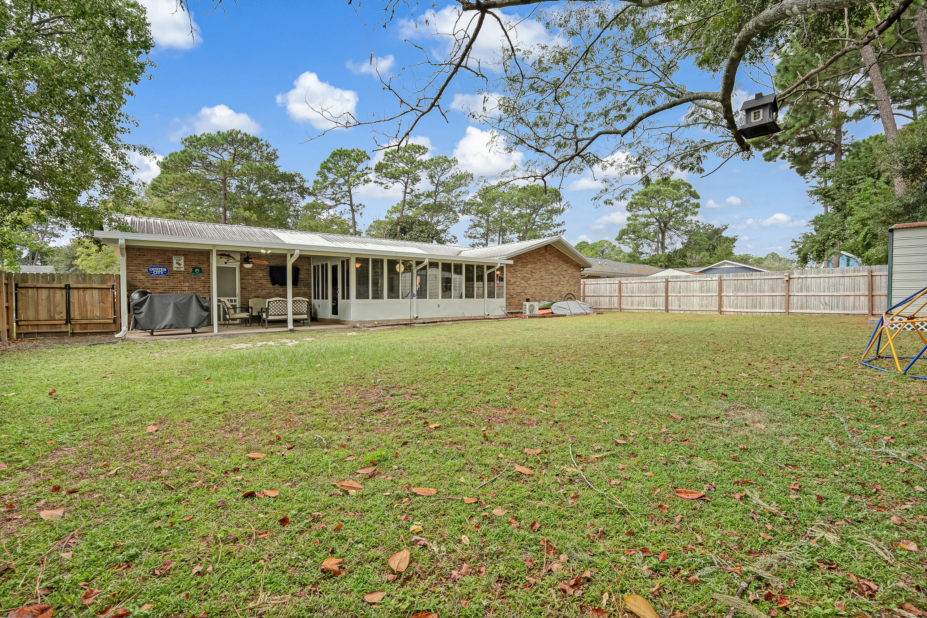 1811 Rattan Palm Drive Niceville, FL 32578 - Photo 47 of 57 a view of a house with a big yard