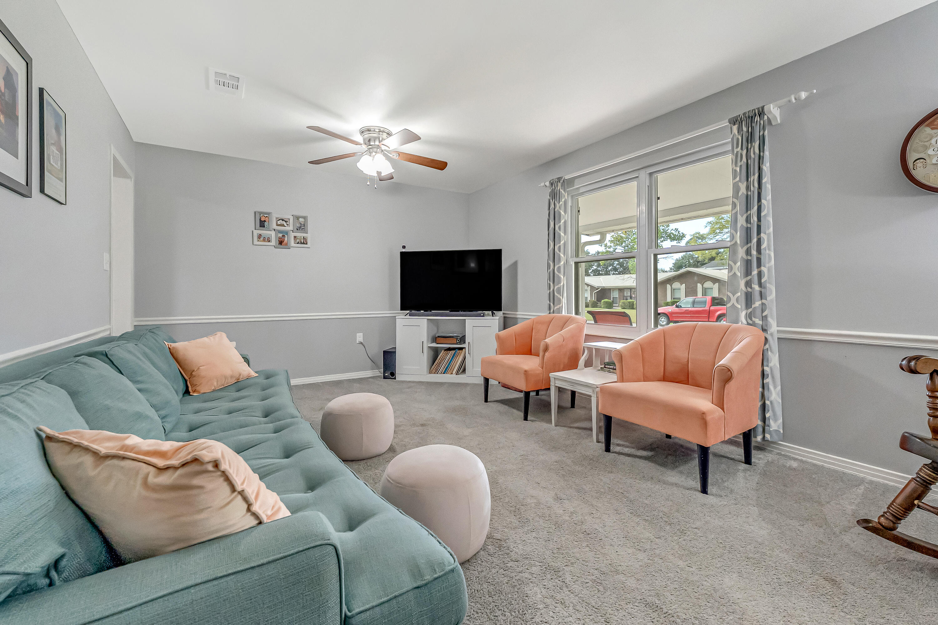 1811 Rattan Palm Drive Niceville, FL 32578 - Photo 5 of 57 a living room with furniture a flat screen tv and a window