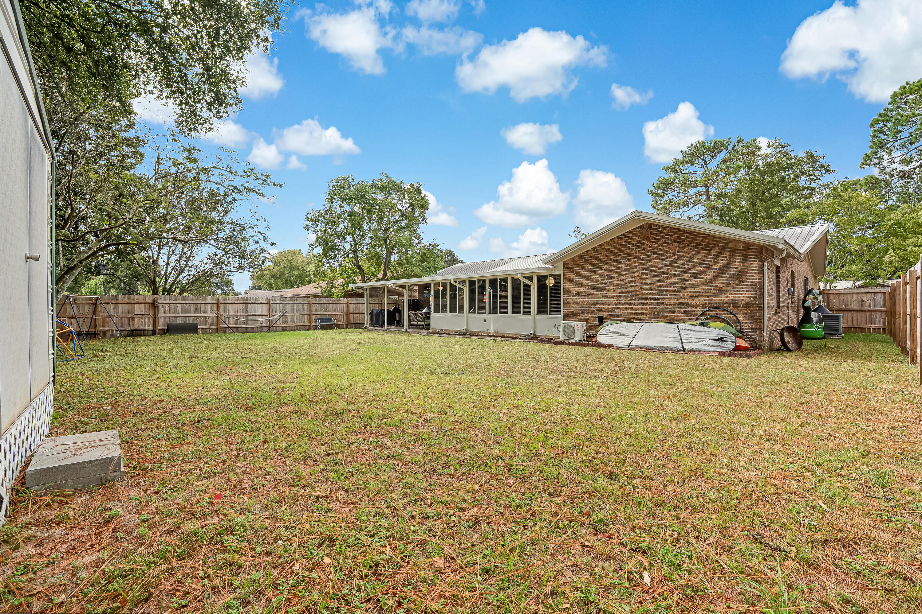 1811 Rattan Palm Drive Niceville, FL 32578 - Photo 51 of 57 a front view of a house with garden