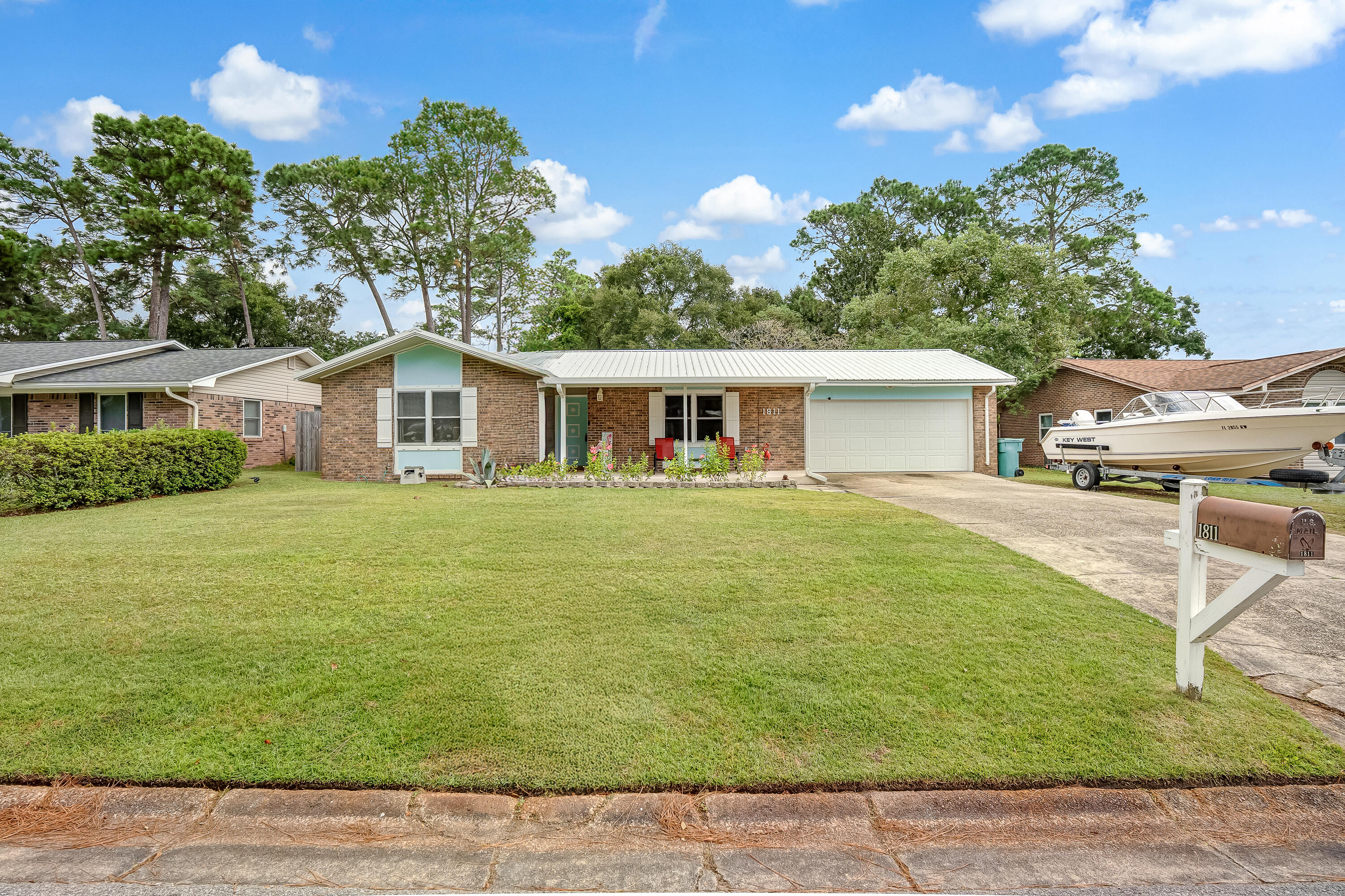 1811 Rattan Palm Drive Niceville, FL 32578 - Photo 53 of 57 a front view of a house with a yard