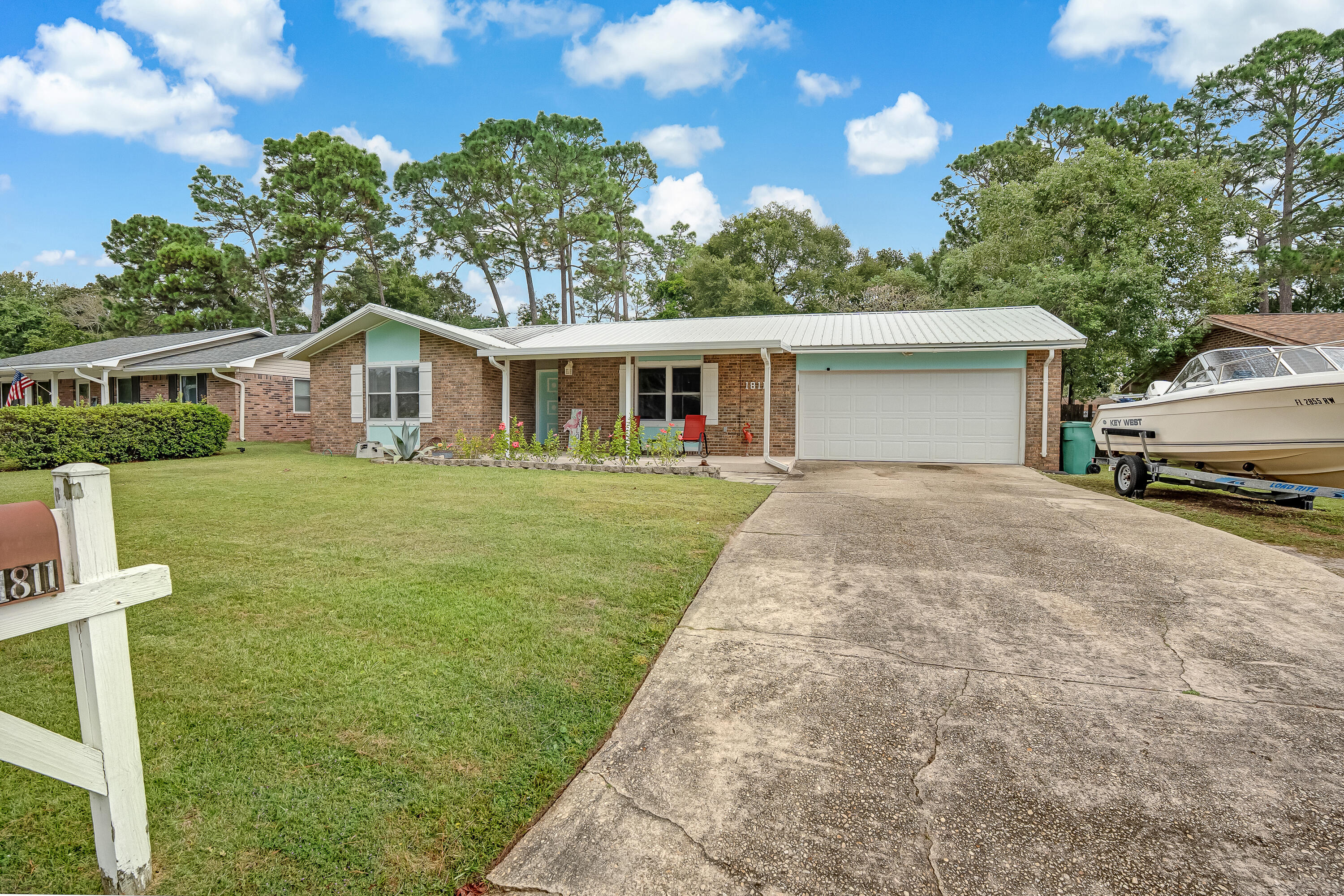 1811 Rattan Palm Drive Niceville, FL 32578 - Photo 54 of 57 a view of a house with a yard