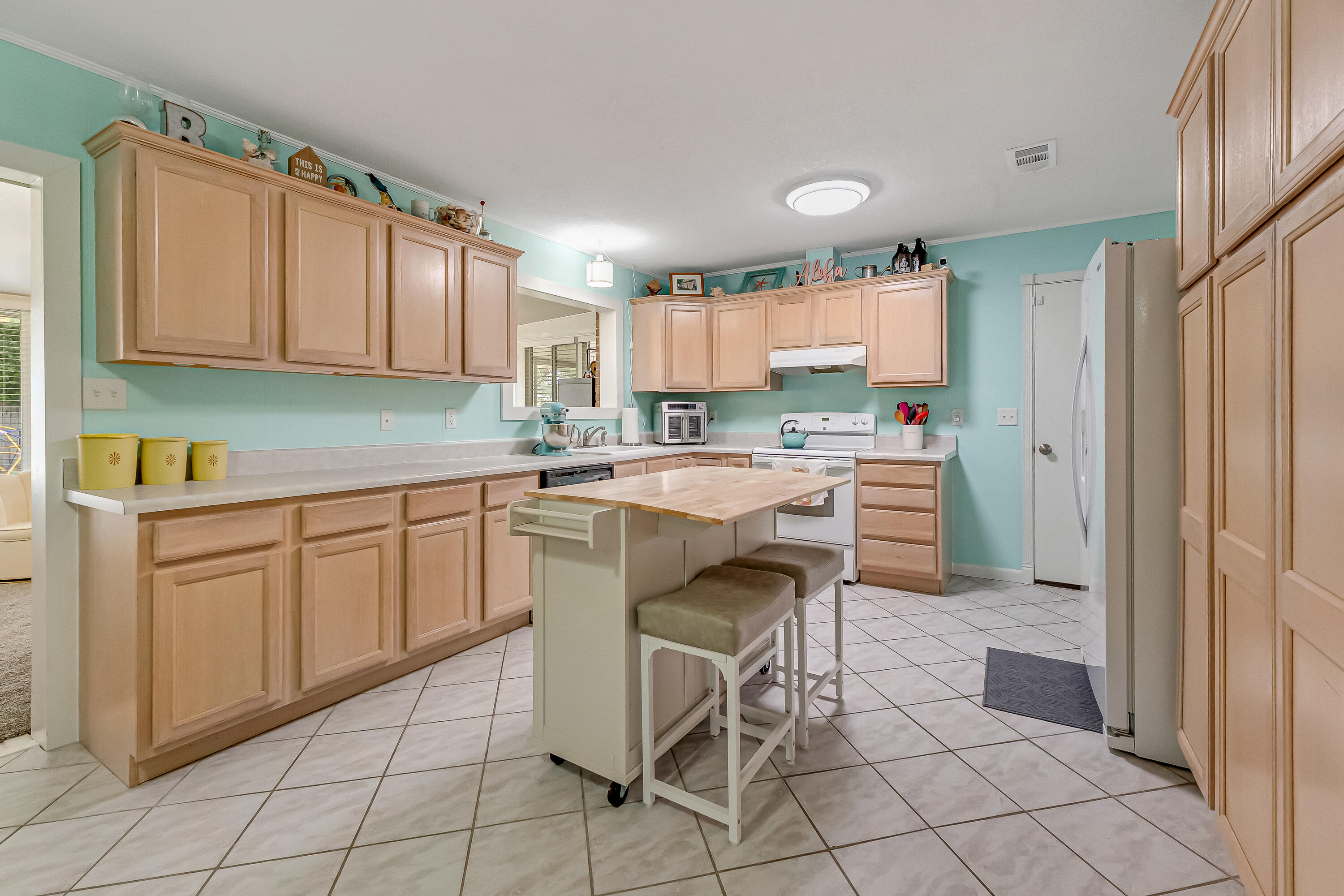 1811 Rattan Palm Drive Niceville, FL 32578 - Photo 9 of 57 a kitchen with a sink cabinets and window
