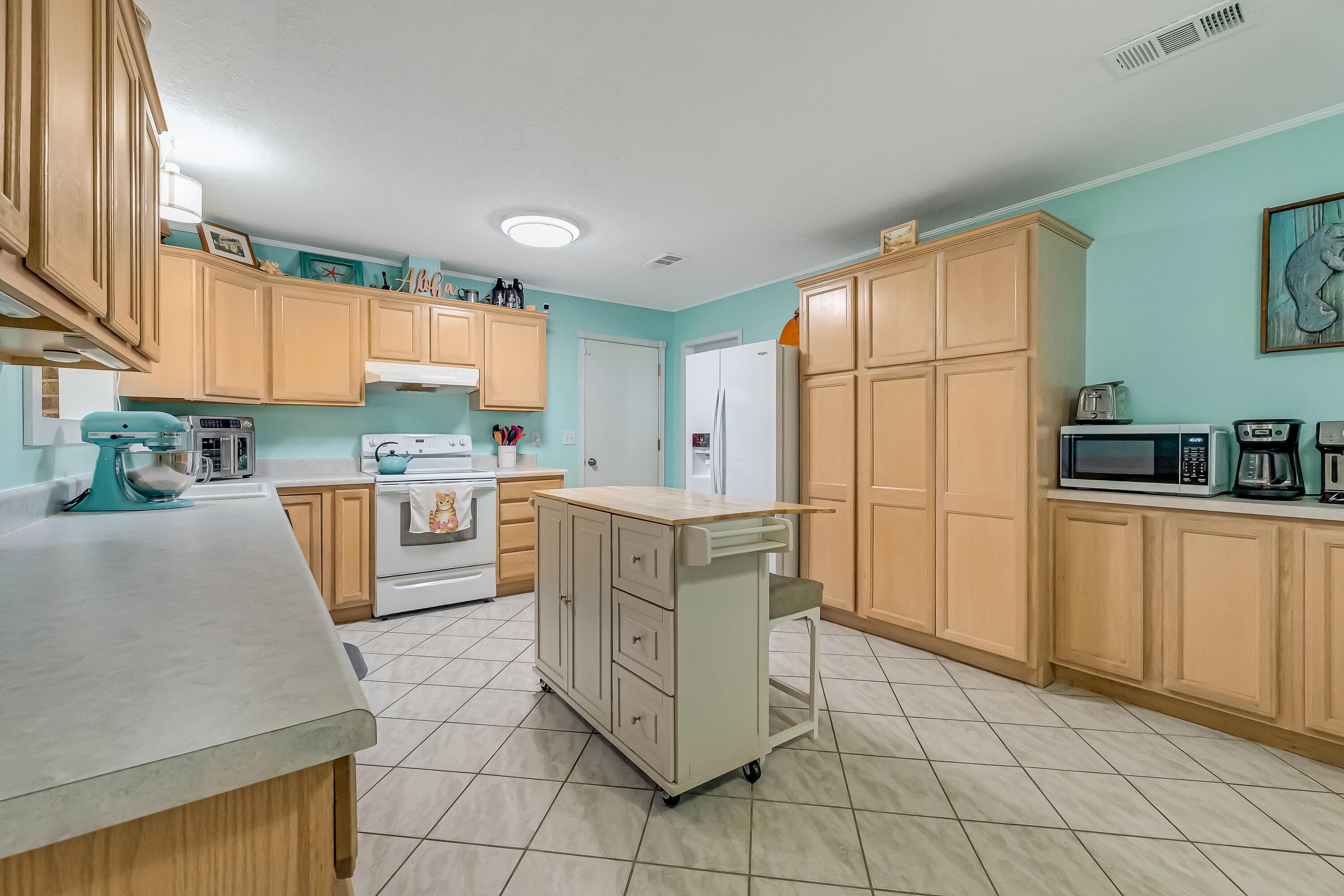 1811 Rattan Palm Drive Niceville, FL 32578 - Photo 10 of 57 a kitchen with cabinets and window