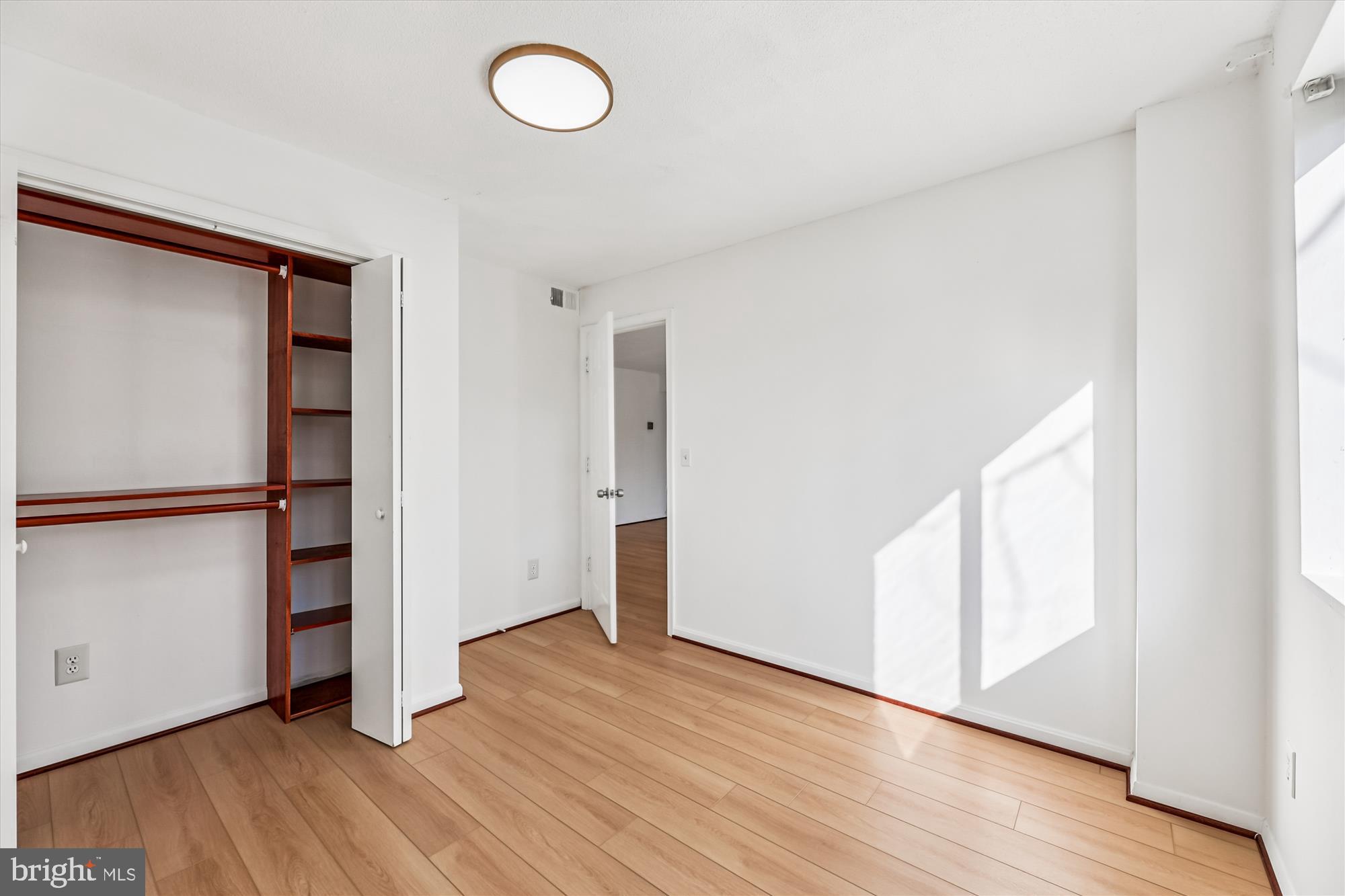 1836 Metzerott Road, Unit T3 Hyattsville, MD 20783 - Photo 13 of 28 an empty room with wooden floor