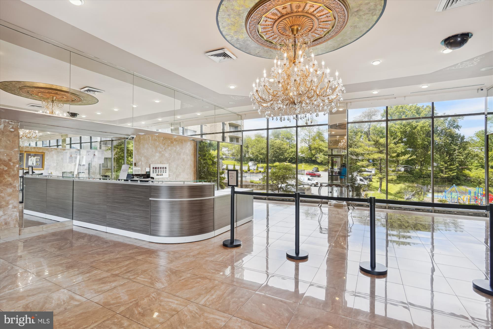 1836 Metzerott Road, Unit T3 Hyattsville, MD 20783 - Photo 22 of 28 a room with lots of white furniture and chandelier