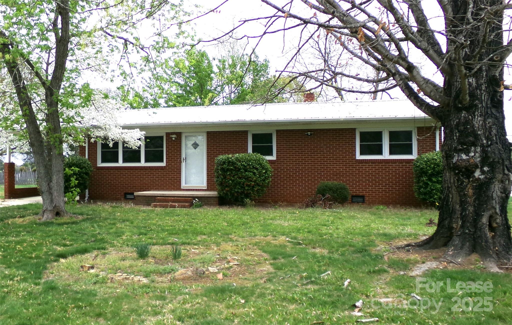 a house view with a garden space