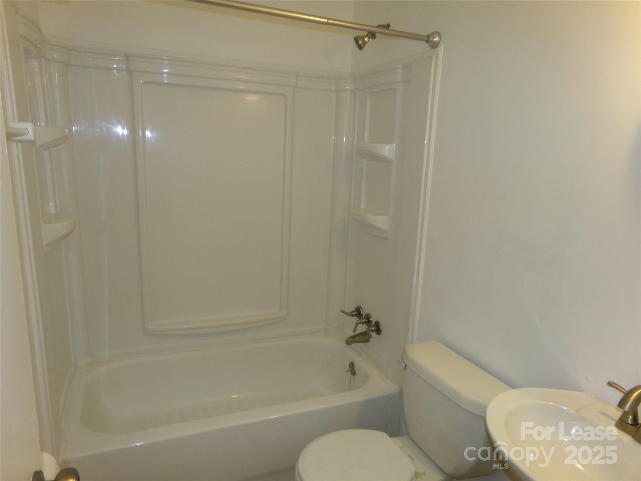 801 Anderson Road Albemarle, NC 28001 - Photo 11 of 23 a bathroom with a toilet and a bathtub