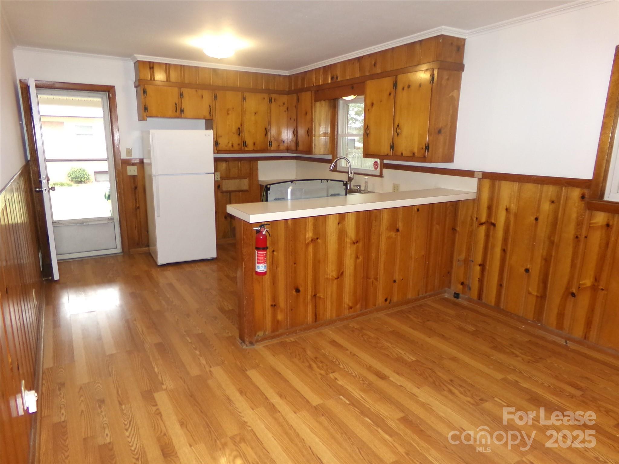 801 Anderson Road Albemarle, NC 28001 - Photo 7 of 23 a view of a kitchen with a sink and a refrigerator