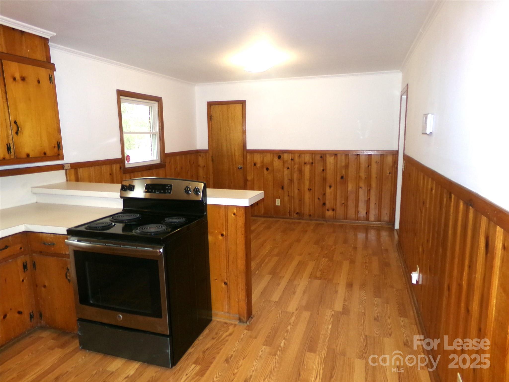 801 Anderson Road Albemarle, NC 28001 - Photo 8 of 23 a kitchen with a sink and wooden floor