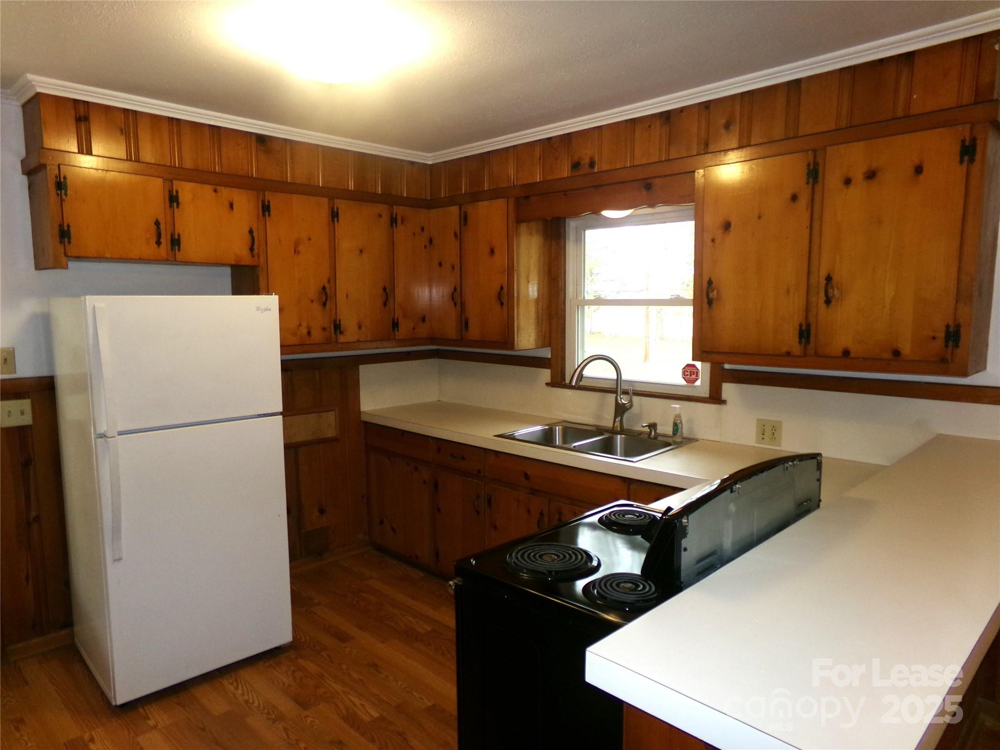 801 Anderson Road Albemarle, NC 28001 - Photo 9 of 23 a kitchen with stainless steel appliances a refrigerator sink and white cabinets