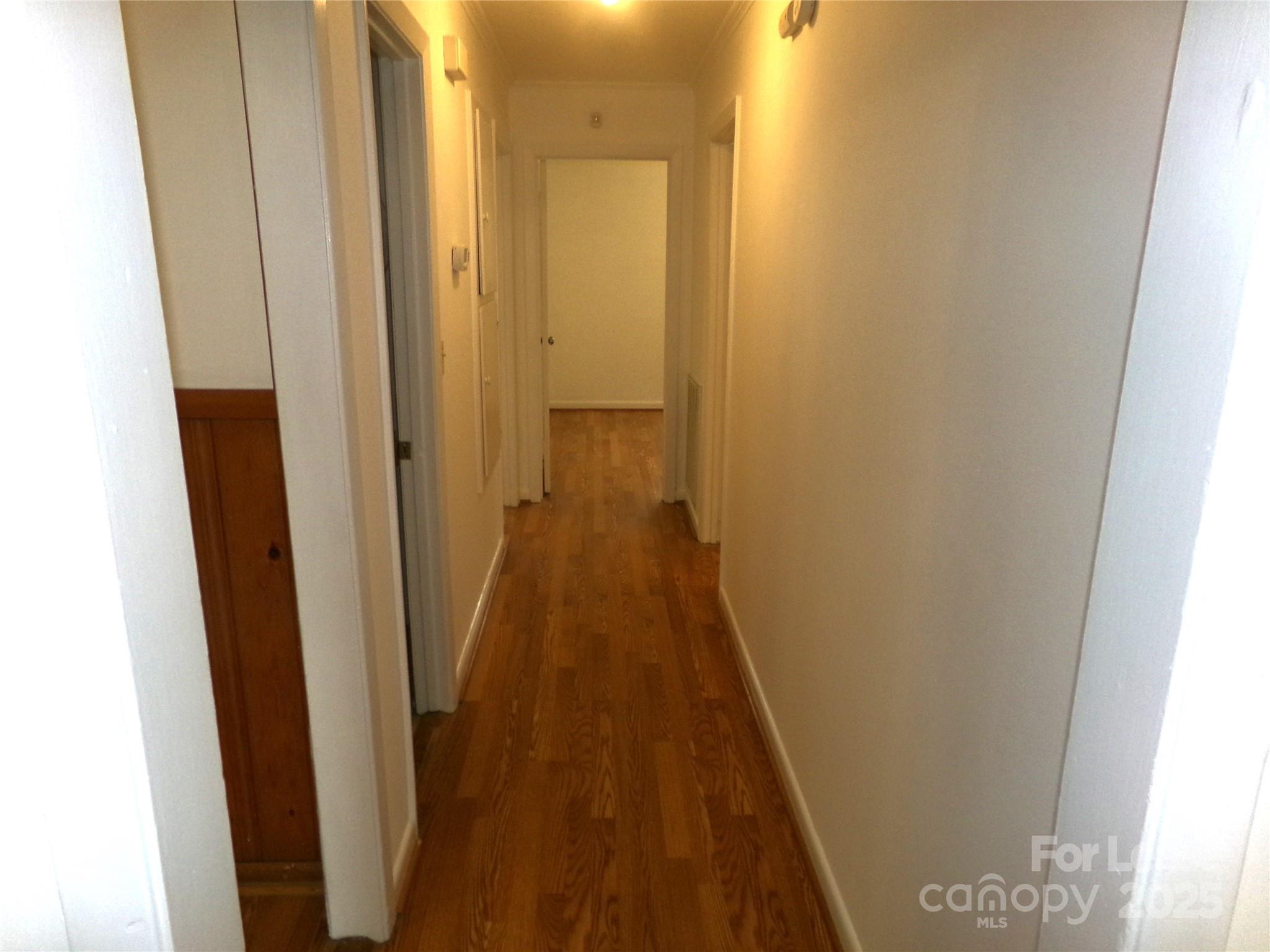 801 Anderson Road Albemarle, NC 28001 - Photo 10 of 23 a view of a hallway with wooden floor