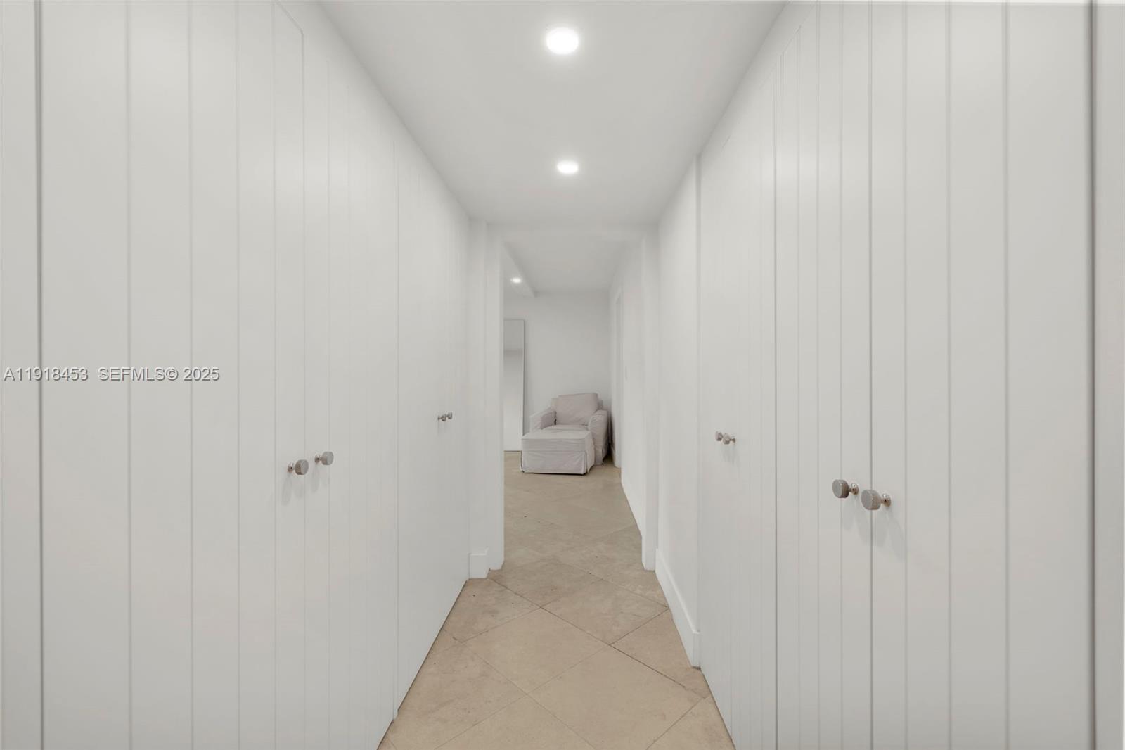 605 Ocean Drive, Unit 2L Key Biscayne, FL 33149 - Photo 20 of 46 CLOSETS ON BOTH SIDES OF HALLWAY TO MASTER BEDROOM