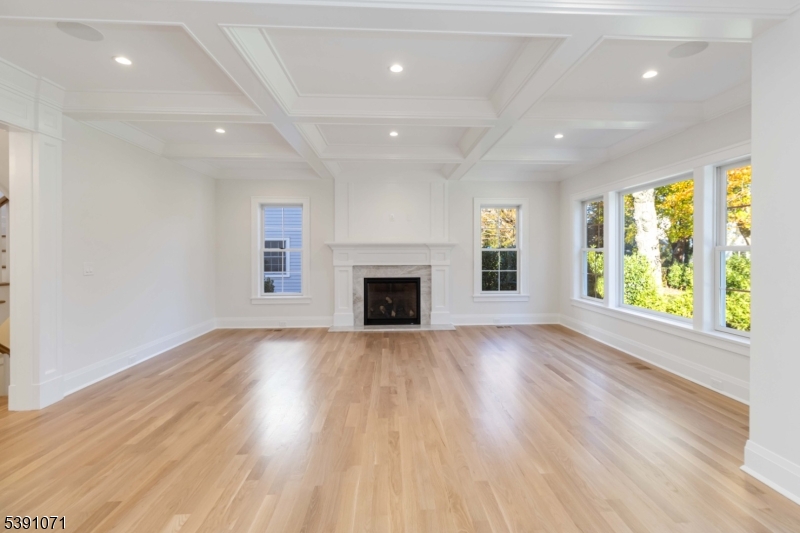 2 Whitman Drive Chatham, NJ 07928 - Photo 18 of 50 an empty room with wooden floor and windows