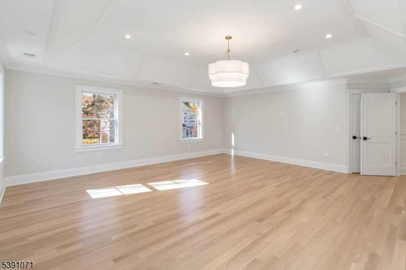 2 Whitman Drive Chatham, NJ 07928 - Photo 25 of 50 an empty room with wooden floor and window