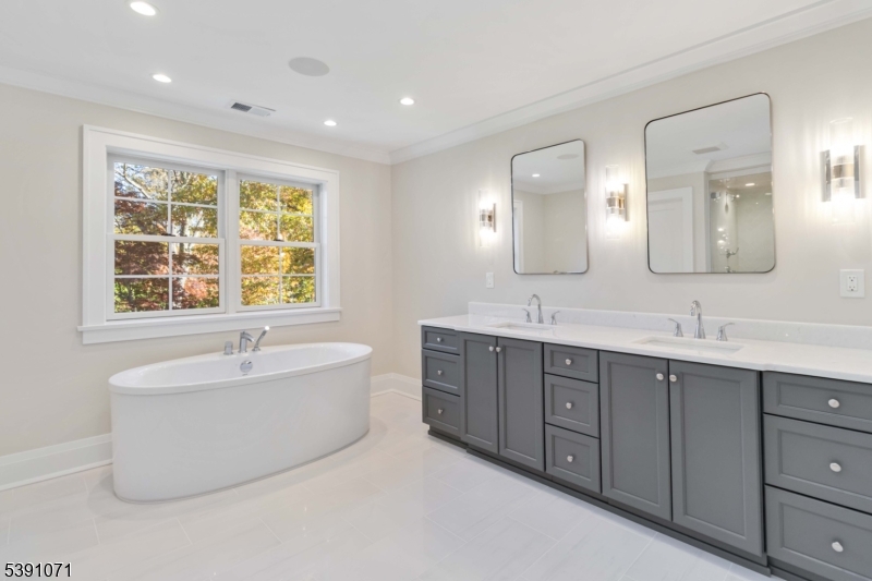2 Whitman Drive Chatham, NJ 07928 - Photo 28 of 50 a spacious bathroom with a tub double sink and mirror
