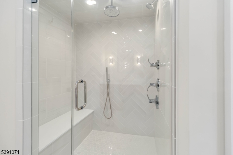 2 Whitman Drive Chatham, NJ 07928 - Photo 29 of 50 a bathroom with a glass shower door