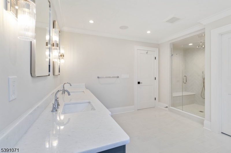 2 Whitman Drive Chatham, NJ 07928 - Photo 30 of 50 a bathroom with a sink a toilet and shower