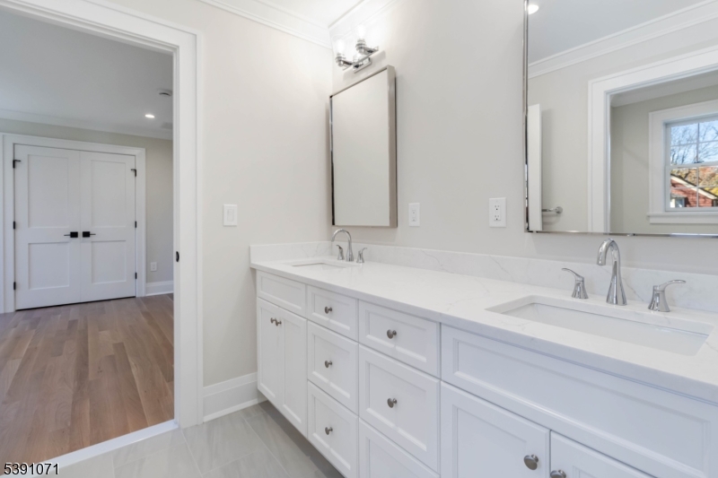 2 Whitman Drive Chatham, NJ 07928 - Photo 33 of 50 a bathroom with double vanity sink and mirror